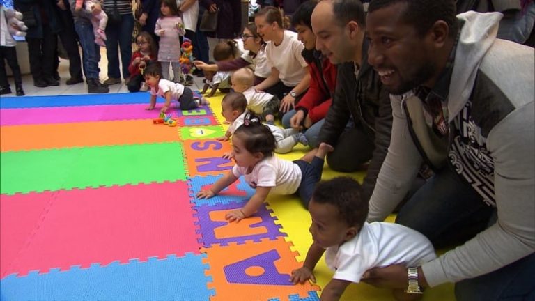 Crowd Enjoyed Baby’s Race By Crawling In To The Finish Line Where Mom Is Waiting