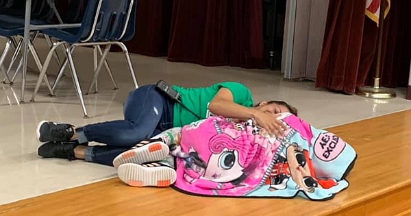 Touching Photo Shows How The Custodian Comforted Autistic Girl During A Breakdown