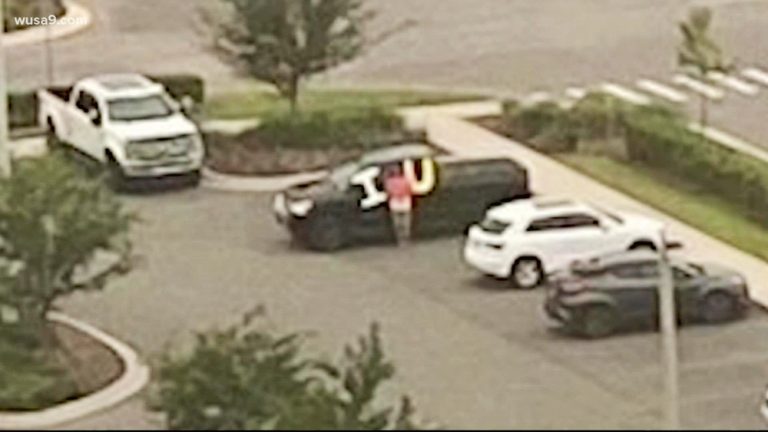 Husband Holds Up ‘I Love You’ Sign Everyday in Hospital Parking Lot to Support Wife in ICU