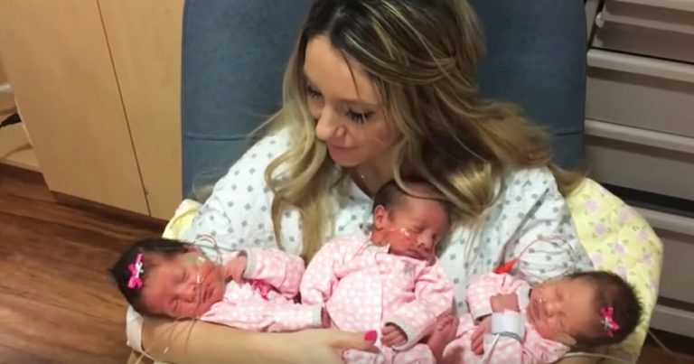Mom holds triplets for the first time with priceless expression