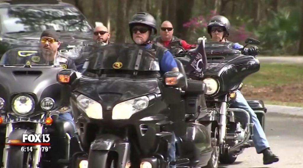 Volunteer bikers of the Combat Veterans Motorcycle Association escort Robert Krause hearse to the Florida National Cemetery.