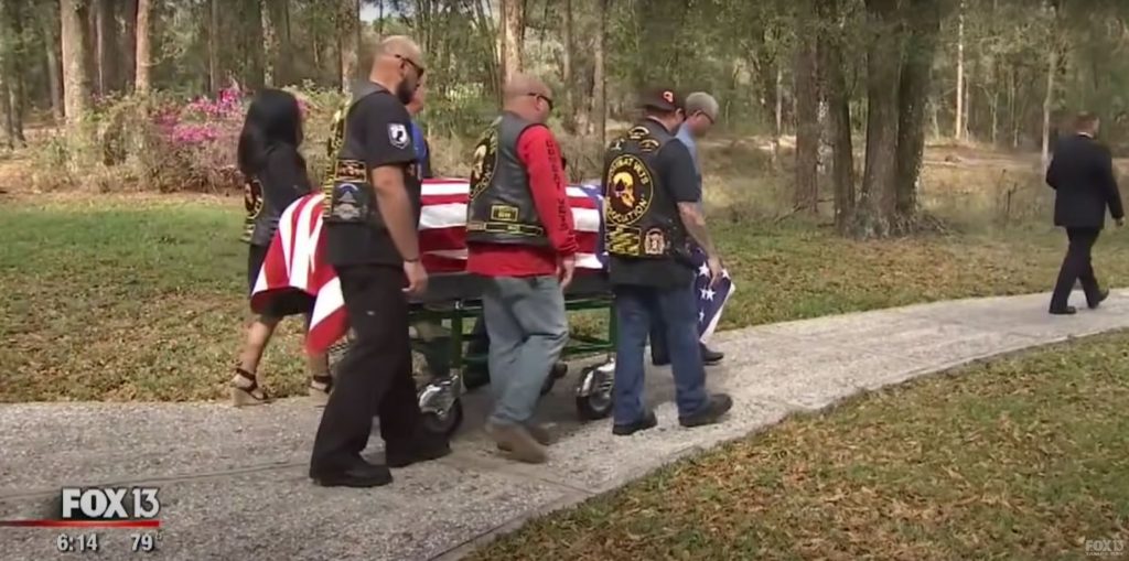 bikers carrying casket