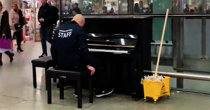 Man Dressed as A Janitor Sits at A Piano and Wows Passersby with Rendition of ‘Bohemian Rhapsody’