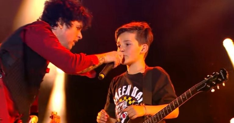 An 11-Year-Old Child Gets a Free Guitar from Green Day while The Band Jams with Him onstage
